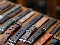Watch strap options displayed on a stand